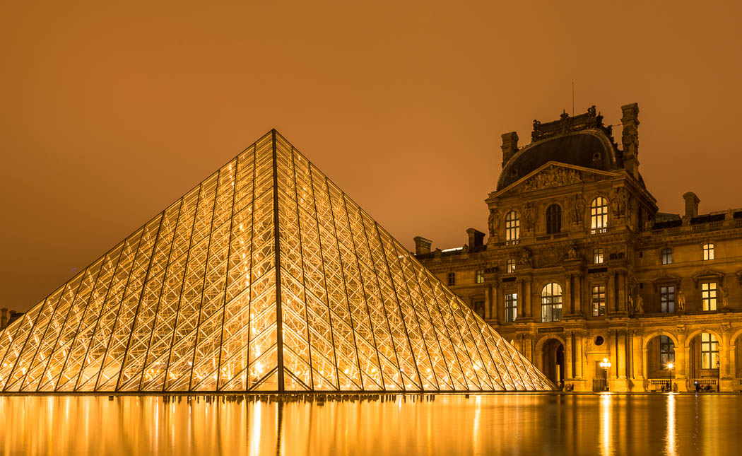Louvre glass pyramid at night by I. M. Pei